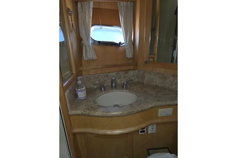 Slide: The Image of Bathroom vanity in 2000 McKinna 48 Pilothouse yacht with marble countertop and sink. - 45