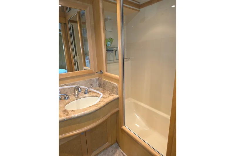 Slide: The Image of Luxurious bathroom in 2000 McKinna 48 Pilothouse yacht with marble sink and glass shower. - 49
