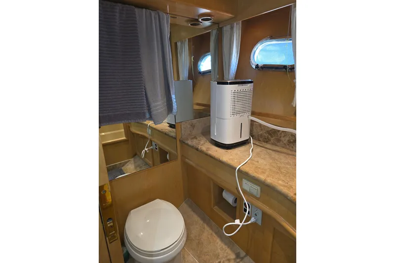 Slide: The Image of Bathroom interior of 2000 McKinna 48 Pilothouse yacht with modern amenities. - 50