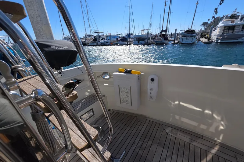 Slide: The Image of 2000 McKinna 48 Pilothouse yacht deck with marina view and clear blue sky. - 55