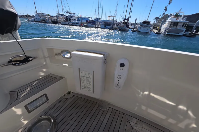 Slide: The Image of 2000 McKinna 48 Pilothouse yacht deck with marina view. - 56