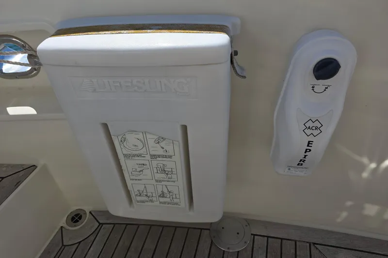 Slide: The Image of Safety equipment on a 2000 McKinna 48 Pilothouse, featuring Lifesling and ACR EPIRB. - 62