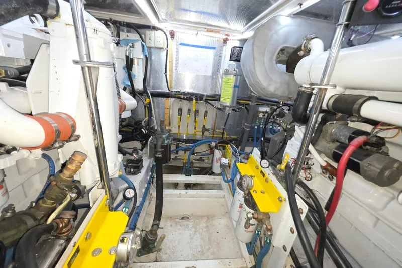 Slide: The Image of Engine room of 2000 McKinna 48 Pilothouse yacht, showcasing mechanical components and systems. - 67