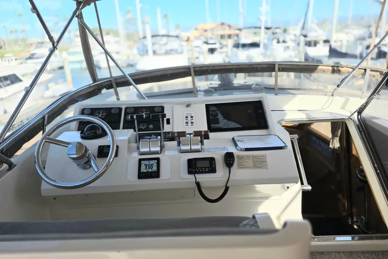 Slide: The Image of Pilothouse of 2000 McKinna 48 yacht with steering wheel and navigation equipment. - 7