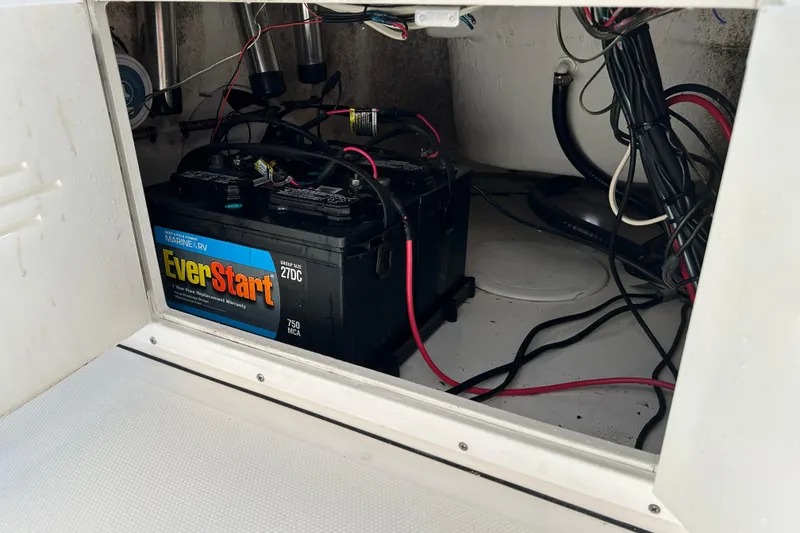 Slide: The Image of Battery compartment of 2014 Tidewater 2100 Bay Max with EverStart marine battery. - 14