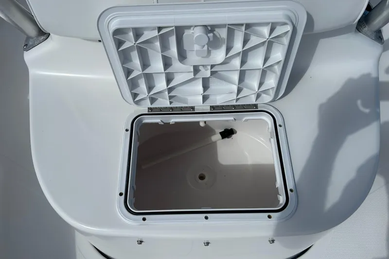 Slide: The Image of Open storage compartment on 2014 Tidewater 2100 Bay Max boat. - 16