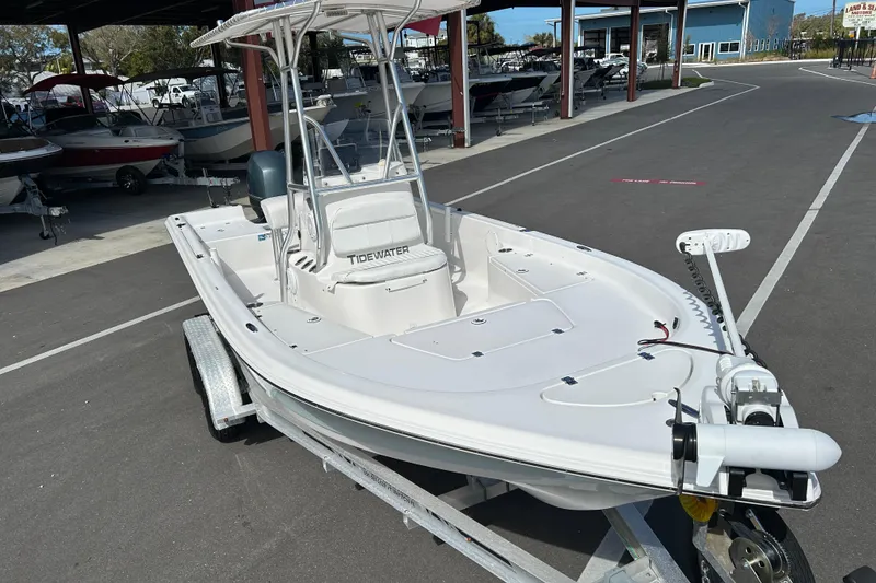 Slide: The Image of 2014 Tidewater 2100 Bay Max boat on trailer in marina setting. - 6