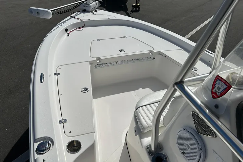Slide: The Image of 2014 Tidewater 2100 Bay Max boat interior with seating and storage compartments. - 8