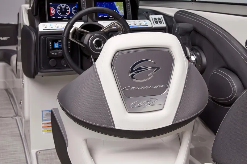 Slide: The Image of 2026 Crownline 288 SS boat helm with modern steering and dashboard controls. - 11