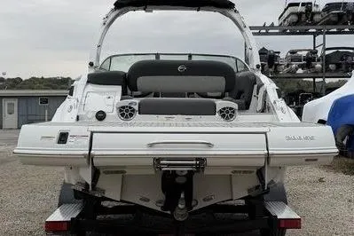 Slide: The Image of 2026 Crownline 288 SS boat, rear view, showcasing sleek design and modern features. - 5