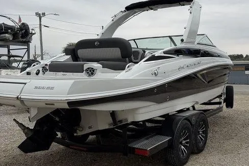 Slide: The Image of 2026 Crownline 288 SS boat on trailer, sleek design, dual-tone exterior. - 6