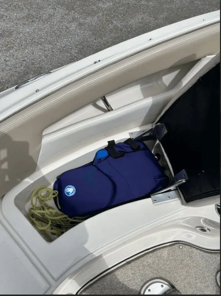 Slide: The Image of Storage compartment in Sea Ray 220 boat with life jacket, 2010 model. - 10