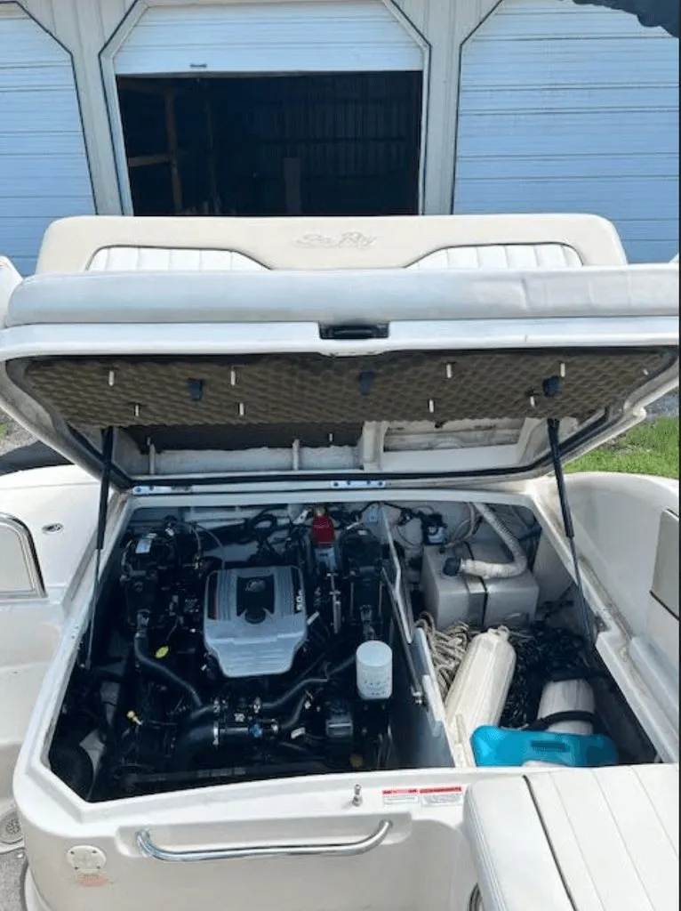 Slide: The Image of Engine compartment of a 2010 Sea Ray 220 boat, open. - 12