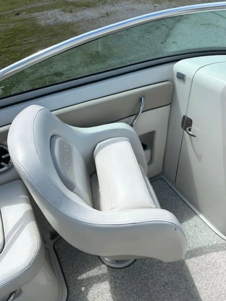 Slide: The Image of Interior of a 2010 Sea Ray 220 boat with gray seating. - 5