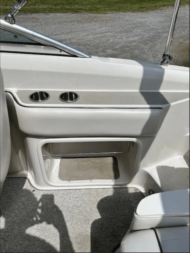 Slide: The Image of Interior of a 2010 Sea Ray 220 boat with cup holders. - 6