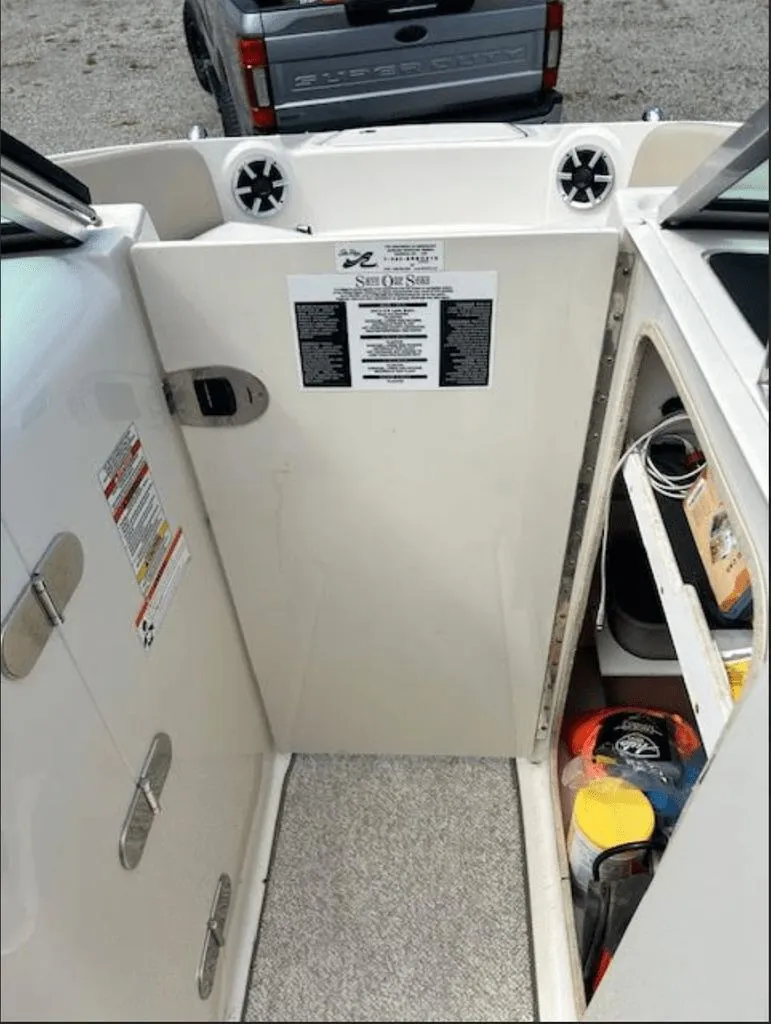 Slide: The Image of Interior of a 2010 Sea Ray 220 with storage and accessories. - 7