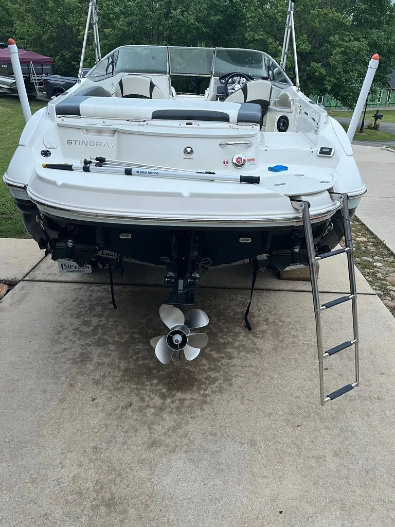 Slide: The Image of Rear view of a 2018 Stingray 235 LR boat on a trailer. - 1