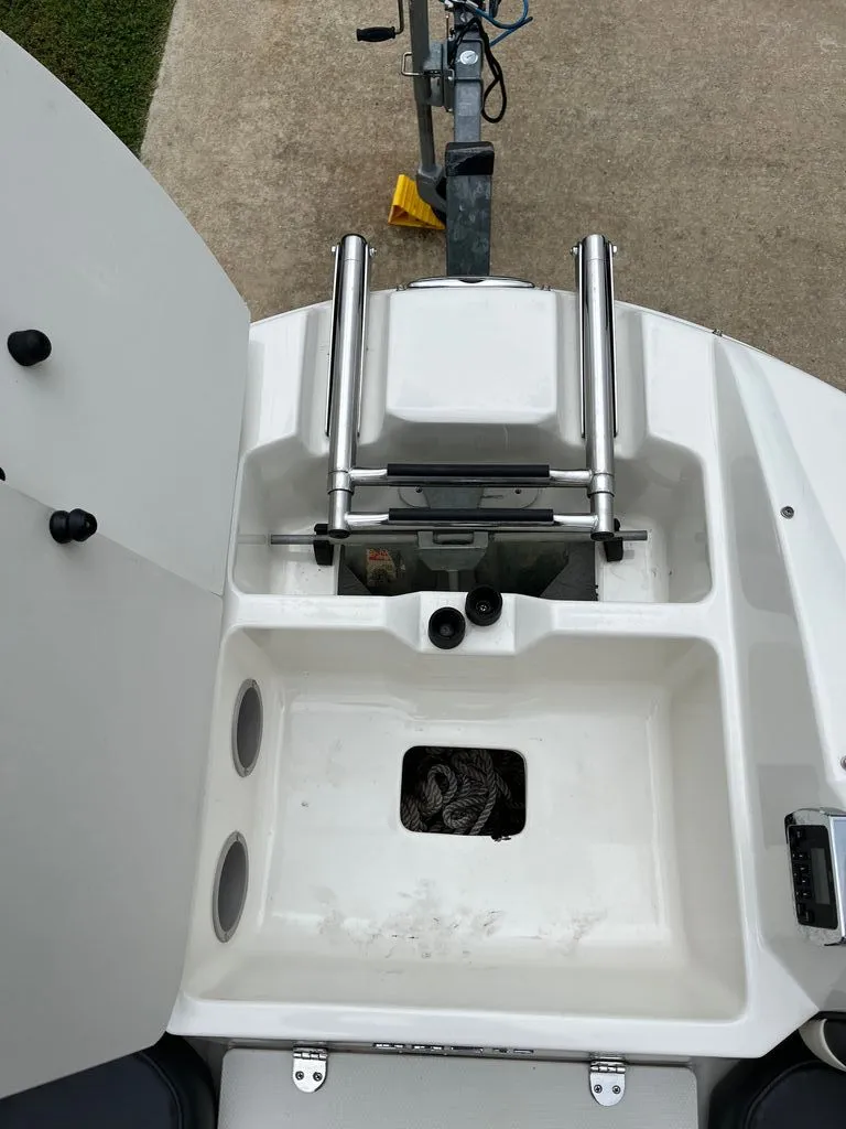 Slide: The Image of Stingray 235 LR 2018 boat with ladder and storage. - 6