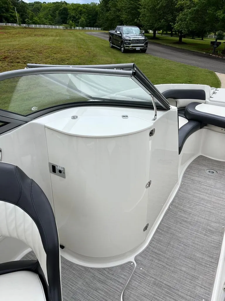 Slide: The Image of Interior of a 2018 Stingray 235 LR boat with gray carpet. - 7