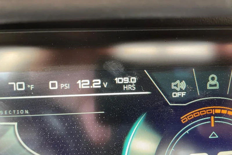 Slide: The Image of Dashboard display of 2021 Nautique Super Air Nautique G25 showing 70°F, 0 PSI, 12.2V, 109 hours. - 13