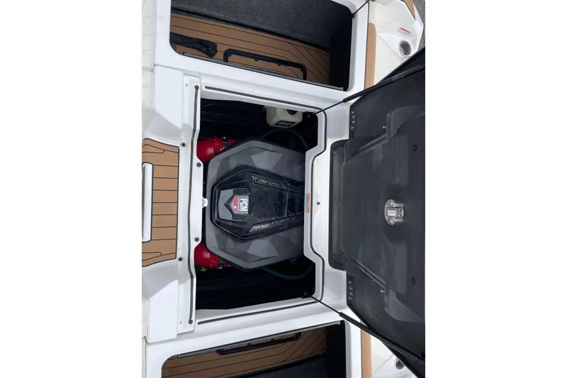 Slide: The Image of 2021 Nautique Super Air Nautique G25 engine compartment with PCM engine visible. - 14