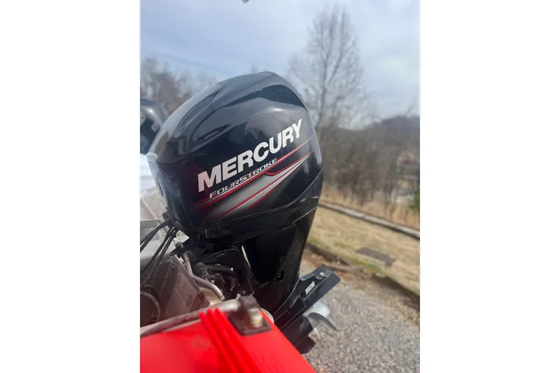 Slide: The Image of 2015 SUNTRACKER BB16 with Mercury FourStroke outboard motor in outdoor setting. - 3