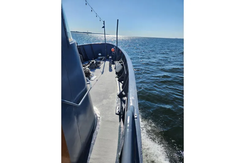 Slide: The Image of 1958 Stephens Brothers Naval Yard Patrol Craft cruising on open water. - 15