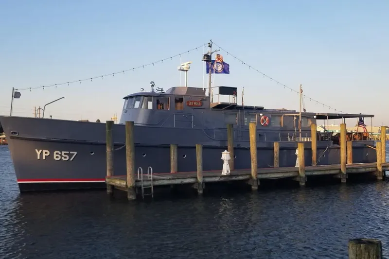 Slide: The Image of 1958 Stephens Brothers Naval Yard Patrol Craft YP 657 docked at a pier. - 2