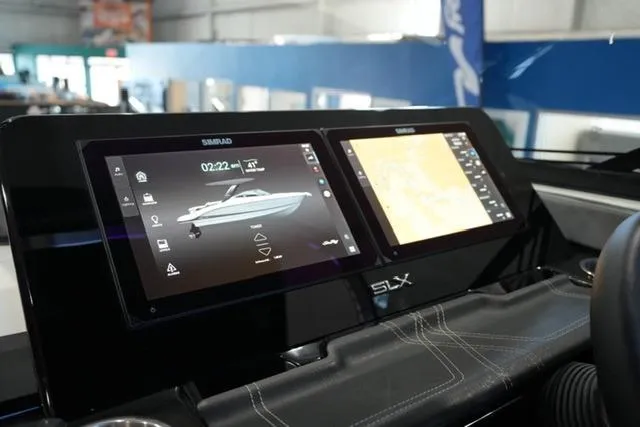 Slide: The Image of Dashboard of 2026 Sea Ray SLX 280 with dual Simrad displays in a modern boat interior. - 19