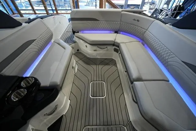 Slide: The Image of Luxurious 2026 Sea Ray SLX 280 boat interior with elegant seating and ambient lighting. - 21
