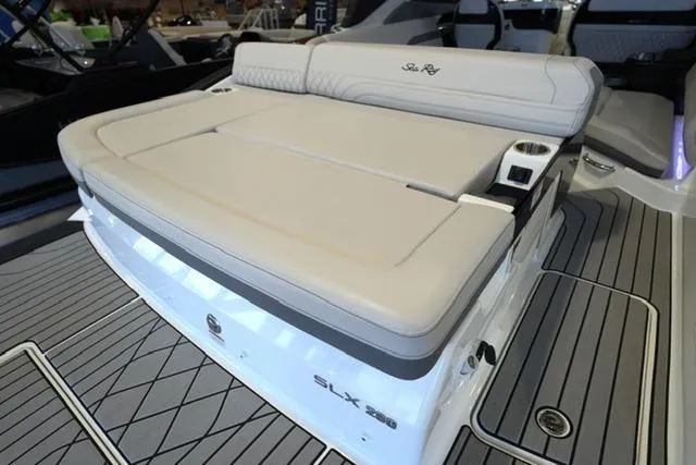 Slide: The Image of 2026 Sea Ray SLX 280 boat with luxurious seating and sleek design. - 24