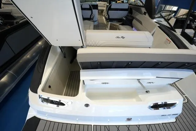 Slide: The Image of 2026 Sea Ray SLX 280 boat interior with open storage compartment and seating area. - 25