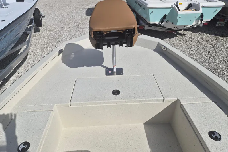 Slide: The Image of 2026 Xpress H20 boat interior with tan seat and storage compartments. - 7