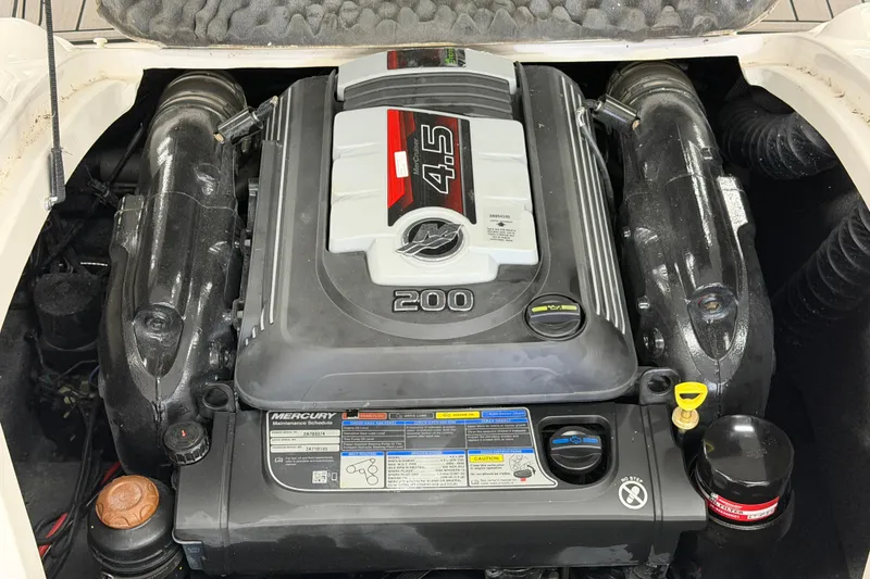 Slide: The Image of Engine compartment of a 2020 Starcraft 2000 IO Limited boat, featuring a Mercury 4.5L engine. - 3