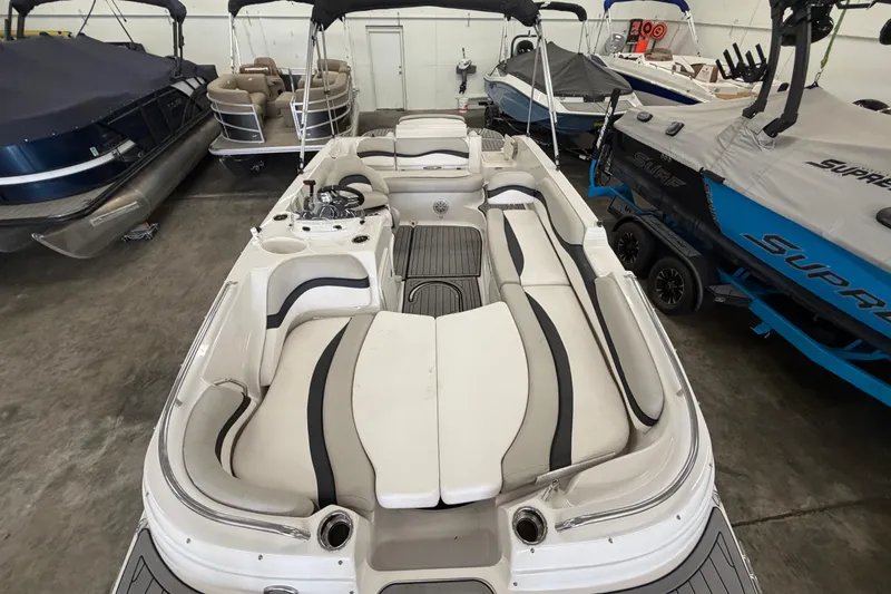 Slide: The Image of 2020 Starcraft 2000 IO Limited boat interior with seating and helm in showroom. - 5