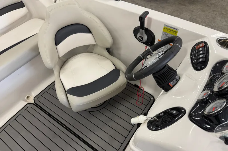 Slide: The Image of 2020 Starcraft 2000 IO Limited boat cockpit with steering wheel and control panel. - 8