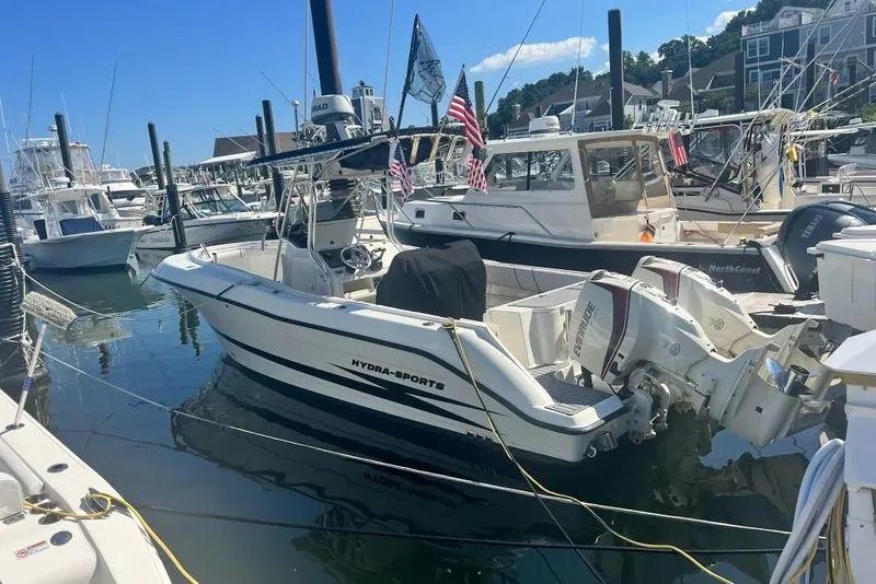 Slide: The Image of 2003 Hydra-Sports Vector 2600 CC boat docked in a marina, surrounded by other vessels. - 3