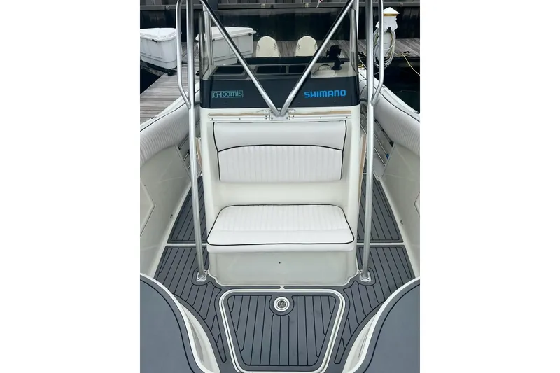 Slide: The Image of 2003 Hydra-Sports Vector 2600 CC boat interior with cushioned seating and sleek design. - 6