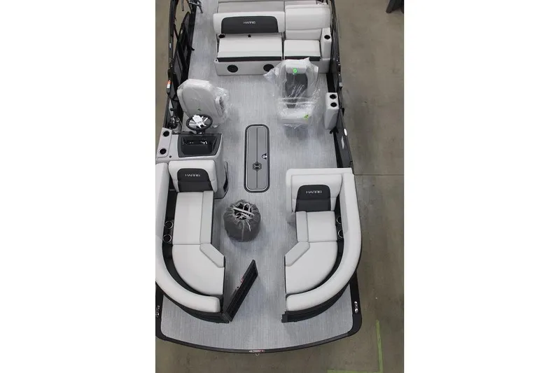 Slide: The Image of 2026 Harris Cruiser 210 pontoon boat interior with modern seating and steering console. - 1