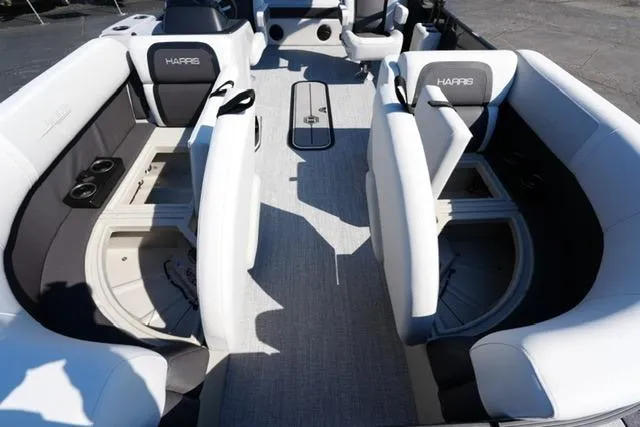 Slide: The Image of 2026 Harris Cruiser 210 interior with spacious seating and modern design. - 16
