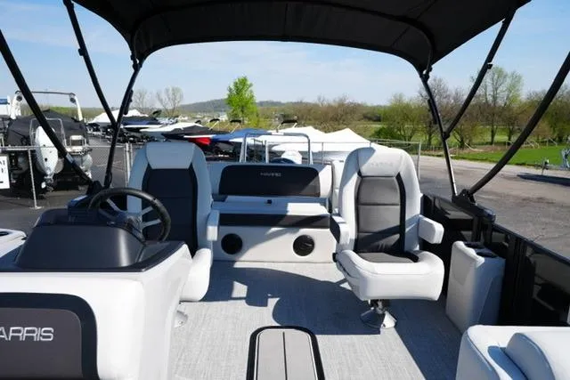Slide: The Image of 2026 Harris Cruiser 210 pontoon boat interior with seating and steering wheel. - 17
