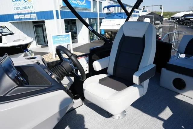 Slide: The Image of Captain's seat on 2026 Harris Cruiser 210 boat, featuring modern controls and sleek design. - 18