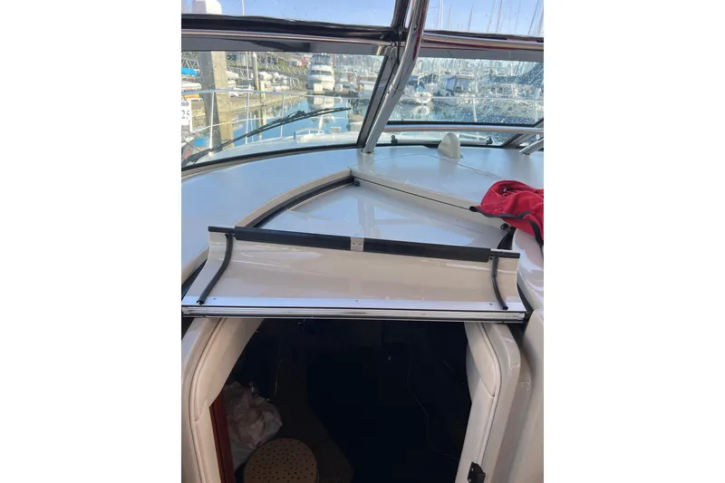 Slide: The Image of 2005 Sea Ray 390 Express Cruiser cabin entrance with marina view. - 10