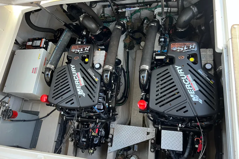 Slide: The Image of Engine room of 2005 Sea Ray 390 Express Cruiser with twin Mercury engines. - 24
