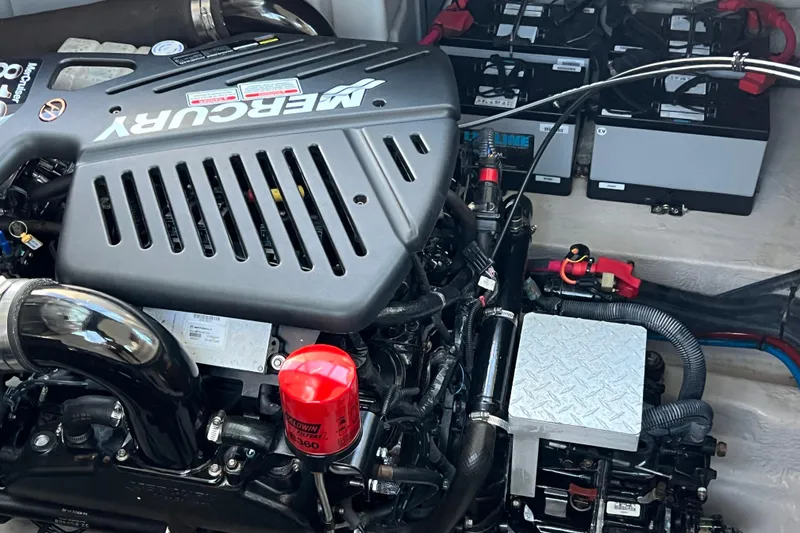 Slide: The Image of Engine compartment of 2005 Sea Ray 390 Express Cruiser with Mercury engine and batteries. - 27