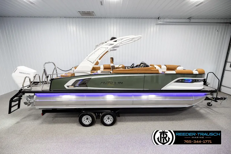 The Image of 2026 Avalon Excalibur LTD FL pontoon boat with sleek design and modern features in showroom. - 1