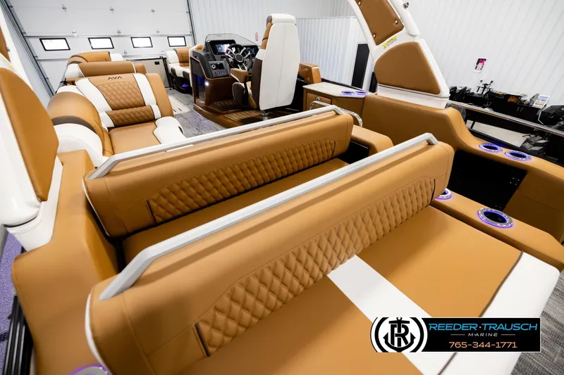 Slide: The Image of Luxurious interior of 2026 Avalon Excalibur LTD FL boat with tan leather seating. - 11