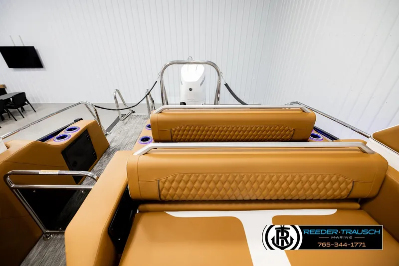 Slide: The Image of Luxurious interior of 2026 Avalon Excalibur LTD FL boat with tan leather seating. - 15