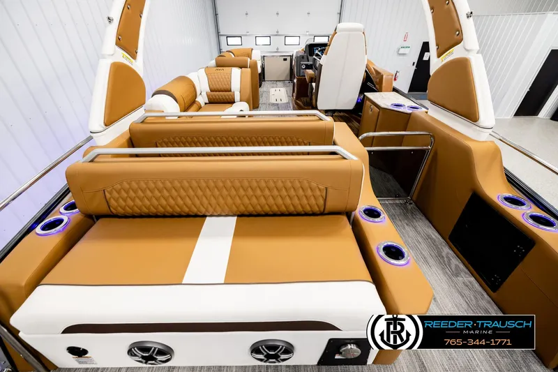 Slide: The Image of Luxurious interior of 2026 Avalon Excalibur LTD FL boat with tan leather seating. - 16