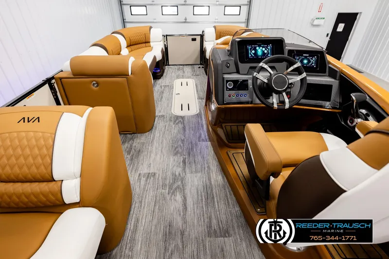 Slide: The Image of Luxurious interior of 2026 Avalon Excalibur LTD FL boat with tan and white seating. - 17